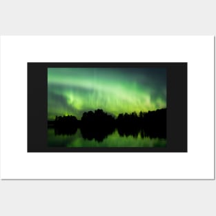 Northern lights glowing over lake in Finland Posters and Art